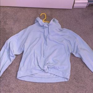 light blue semicropped sweatshirt w/ knot in front